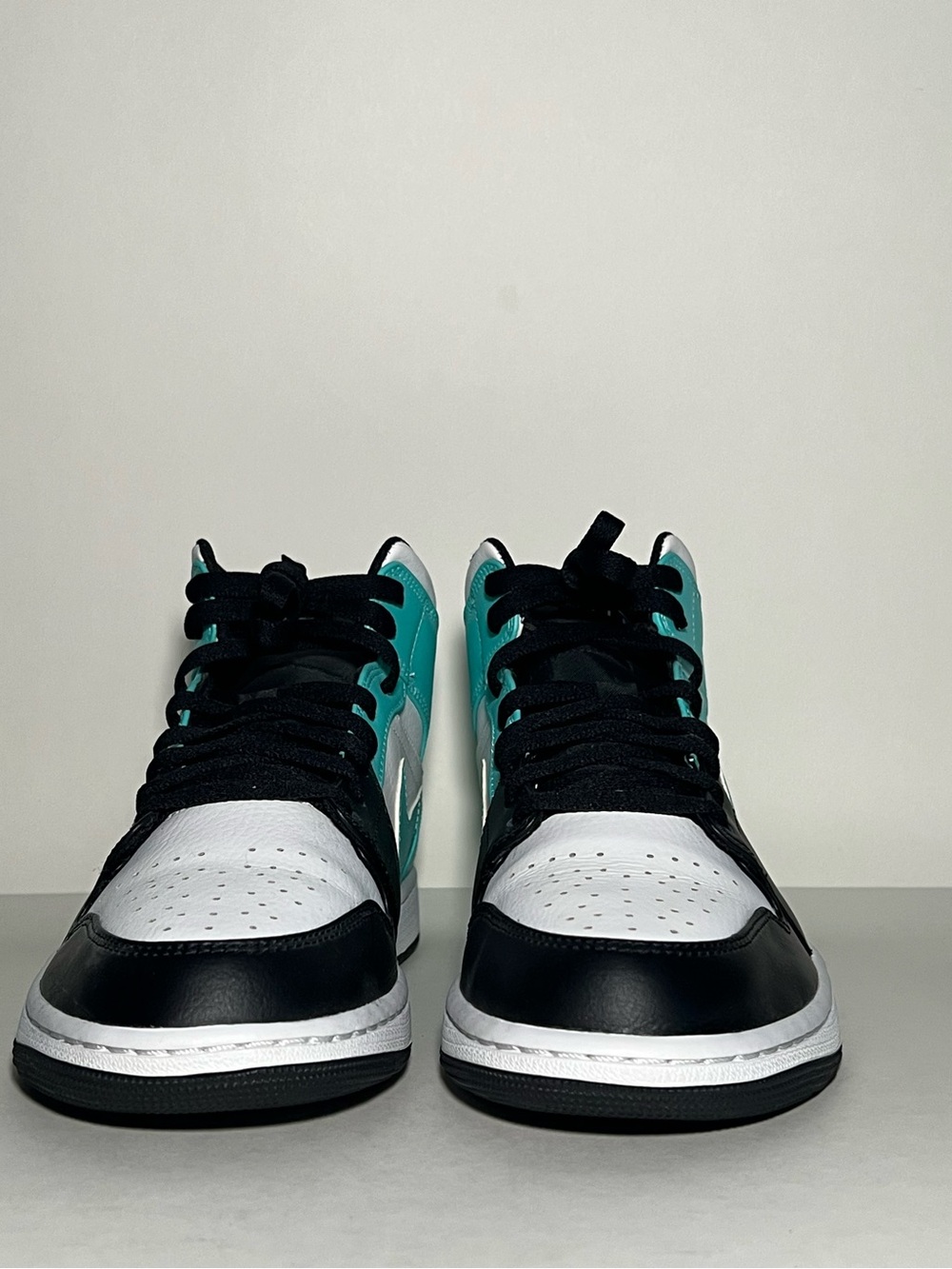 Air Jordan 1 Mid Sneakers in Black, White & Teal